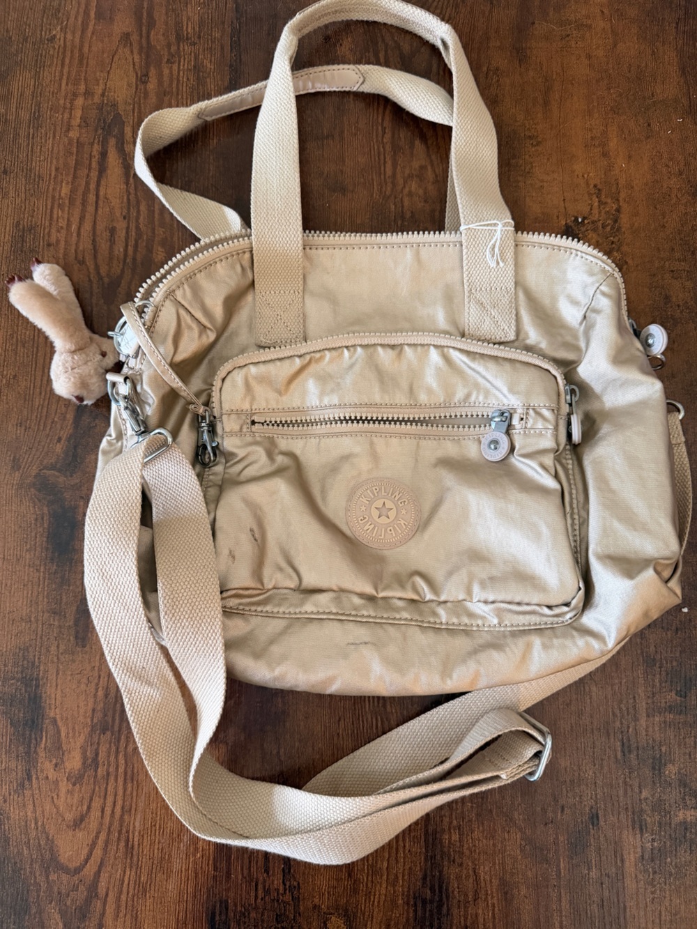 Kipling Metallic Champagne Crossbody Bag with Plush Charm